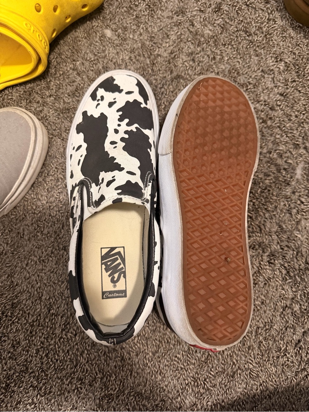 Vans Kids Slip-On Sneakers in Black & White Cow Pattern